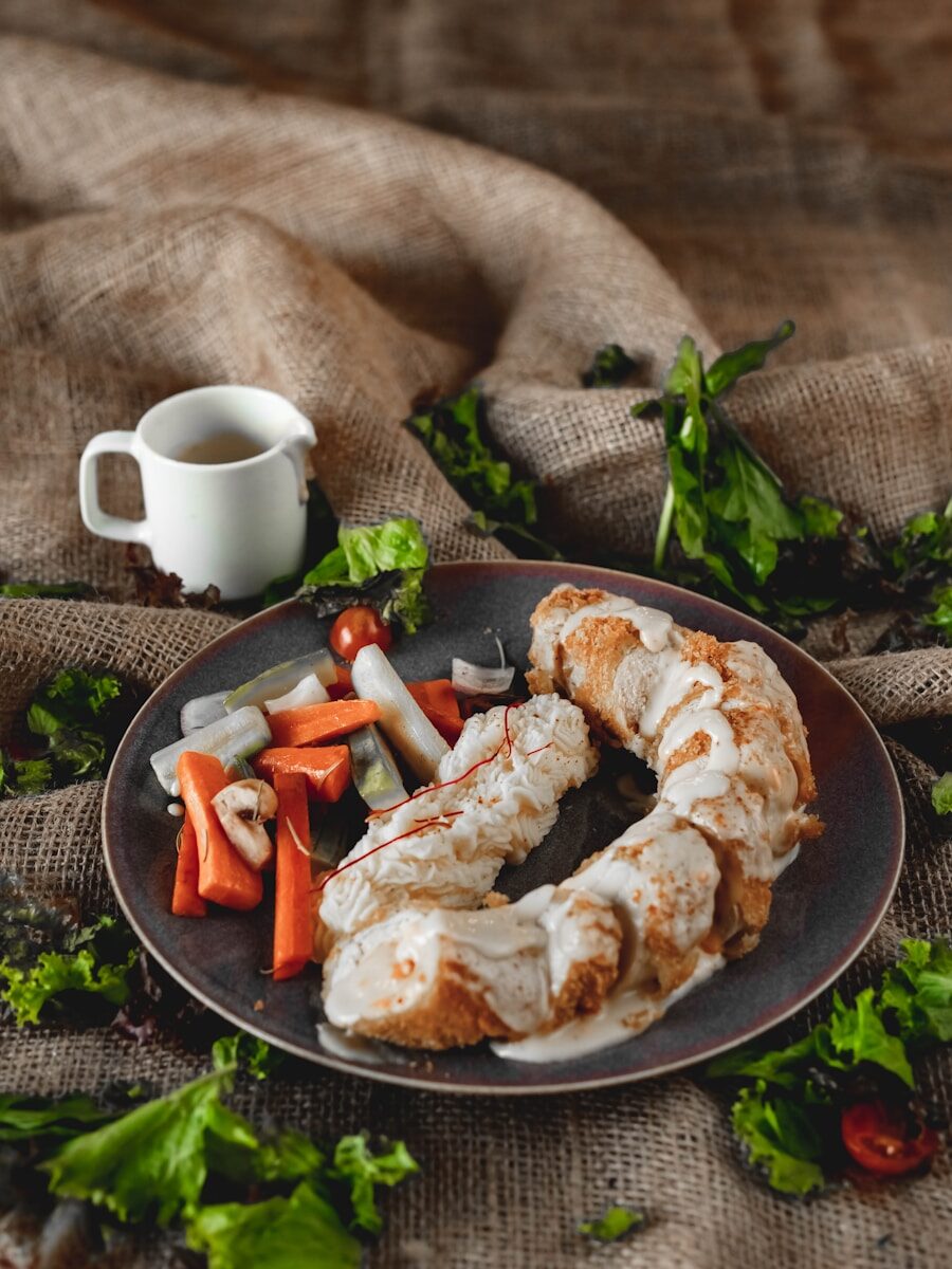 A plate of food with chicken and vegetables