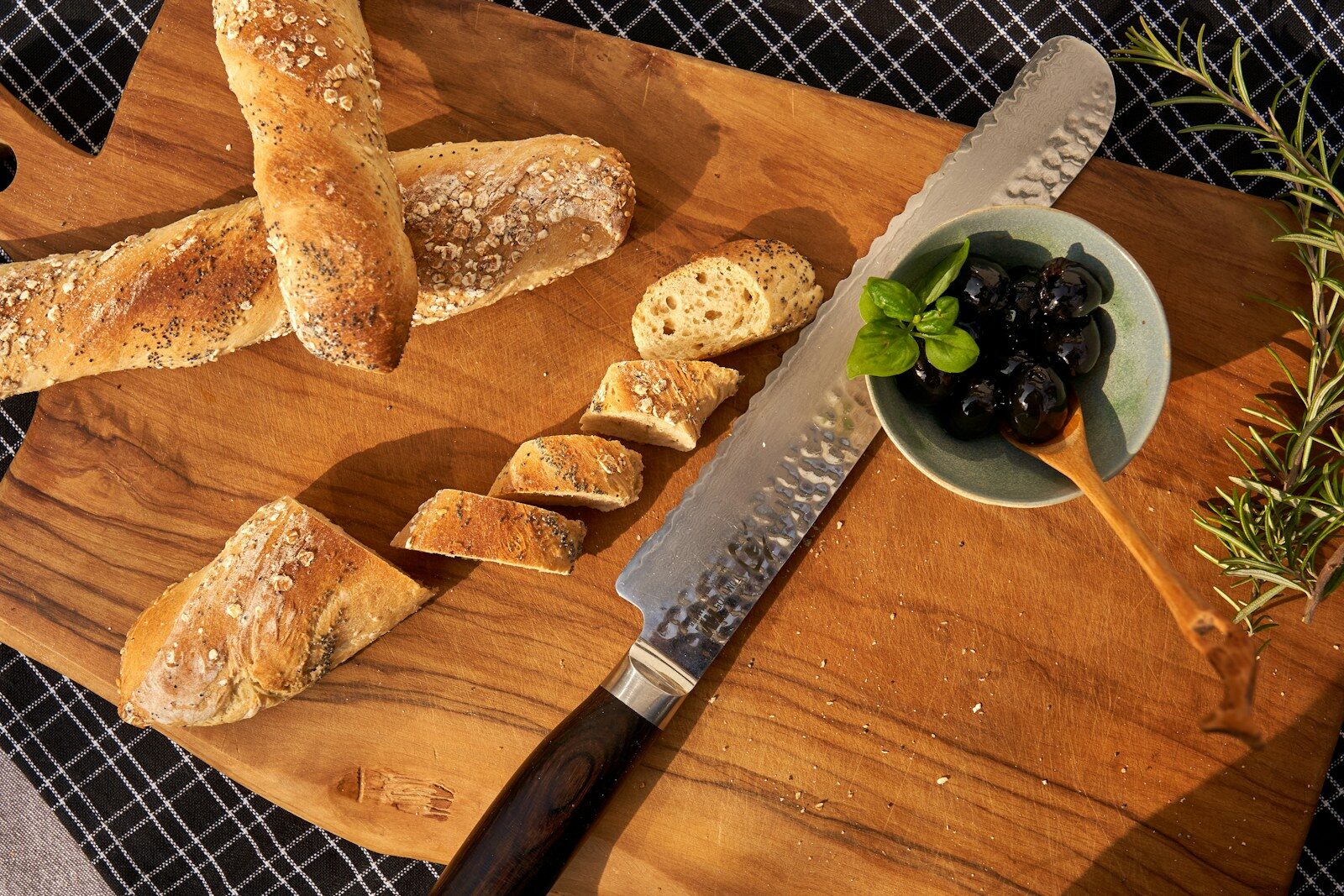 sliced bread on brown wooden chopping board